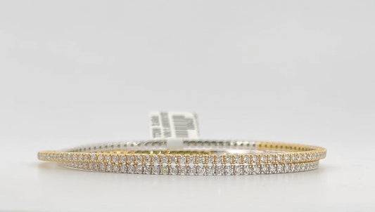 14K 3.50ctw Diamond Two-tone wrap around flexible bangle.